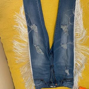 Tassel distressed blue jeans